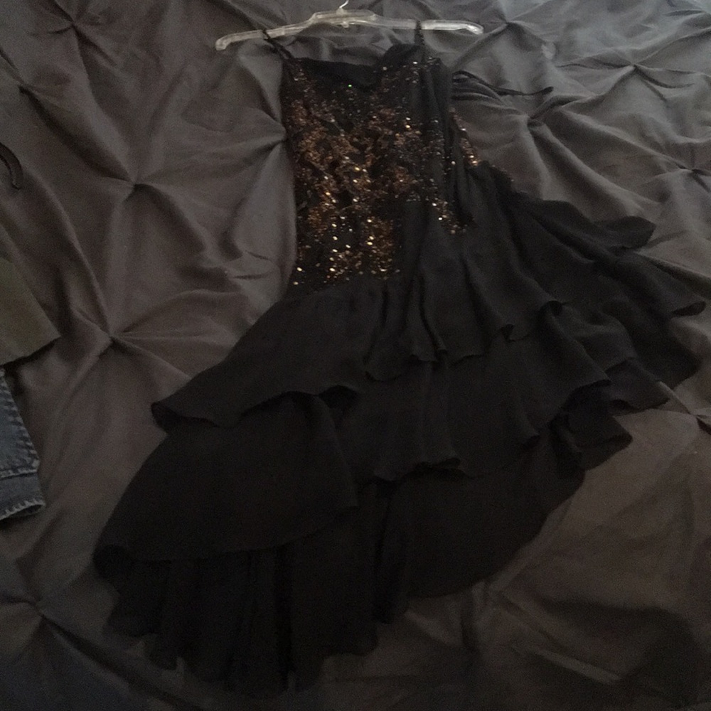Black asymmetrical dress with gold sequins